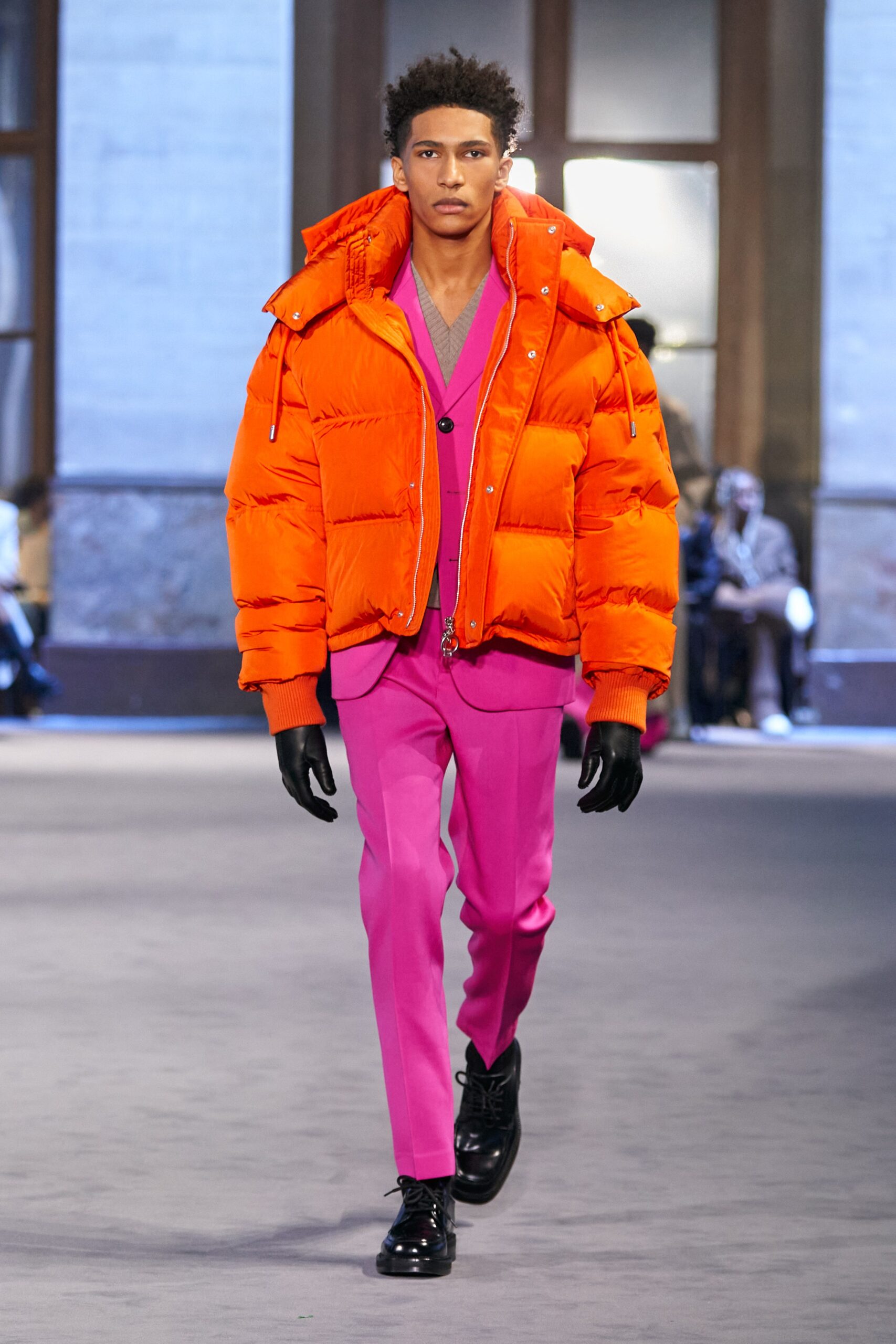 orange puffer jacket with pink suit