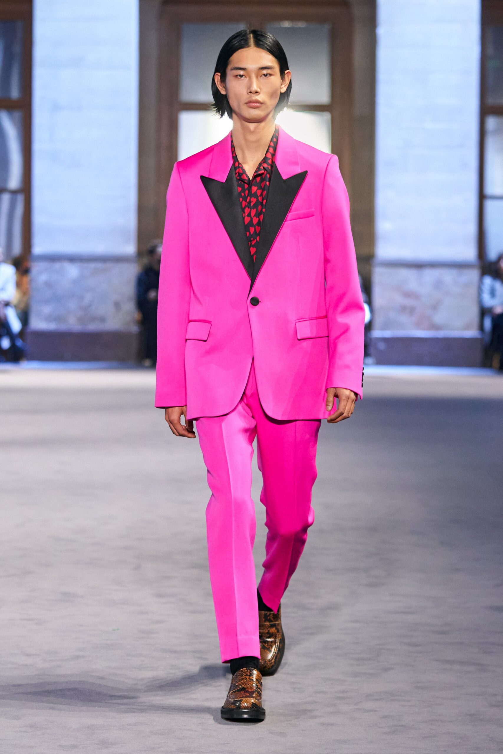 pink tailored suit with black shirt