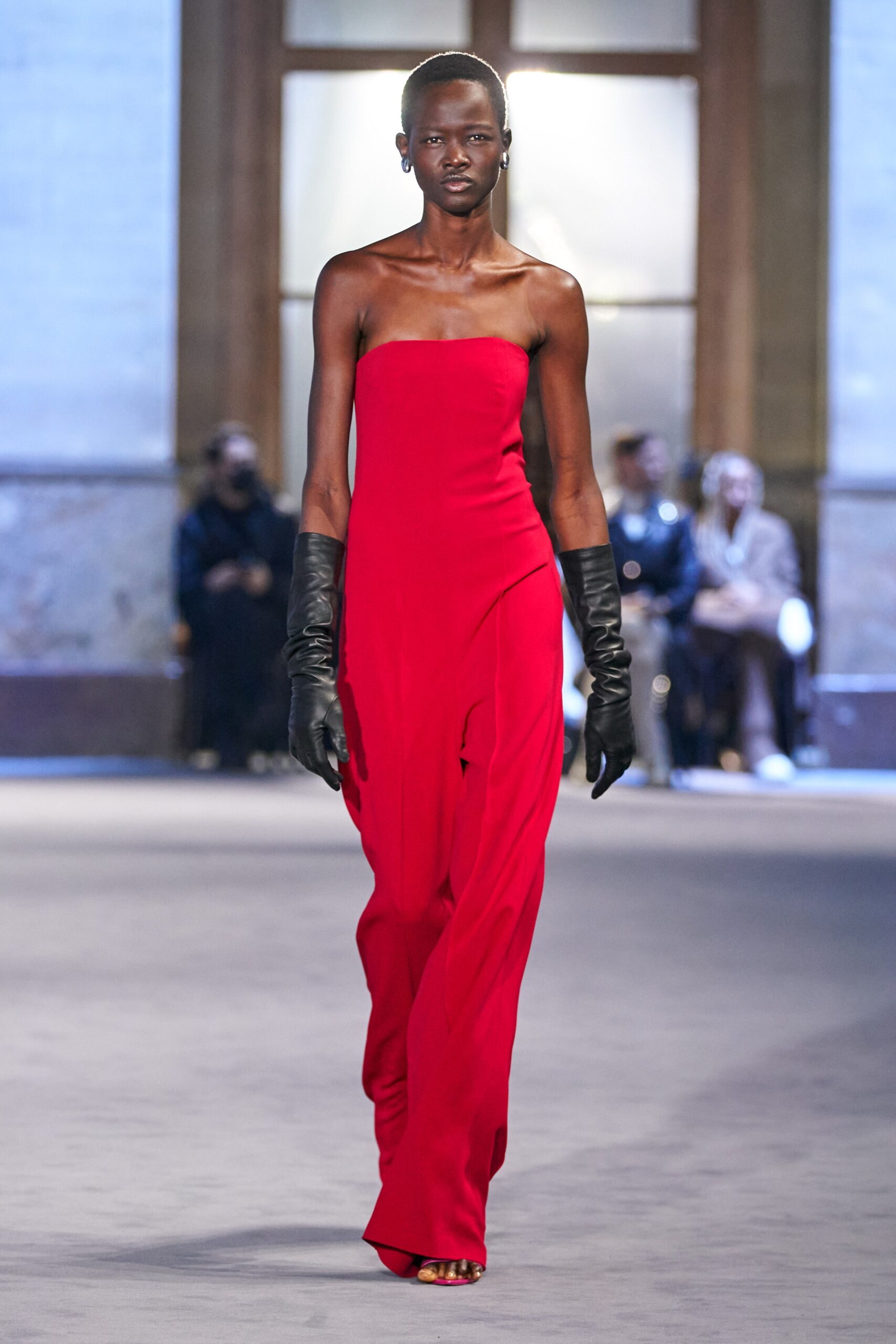 red strapless gown with gloves