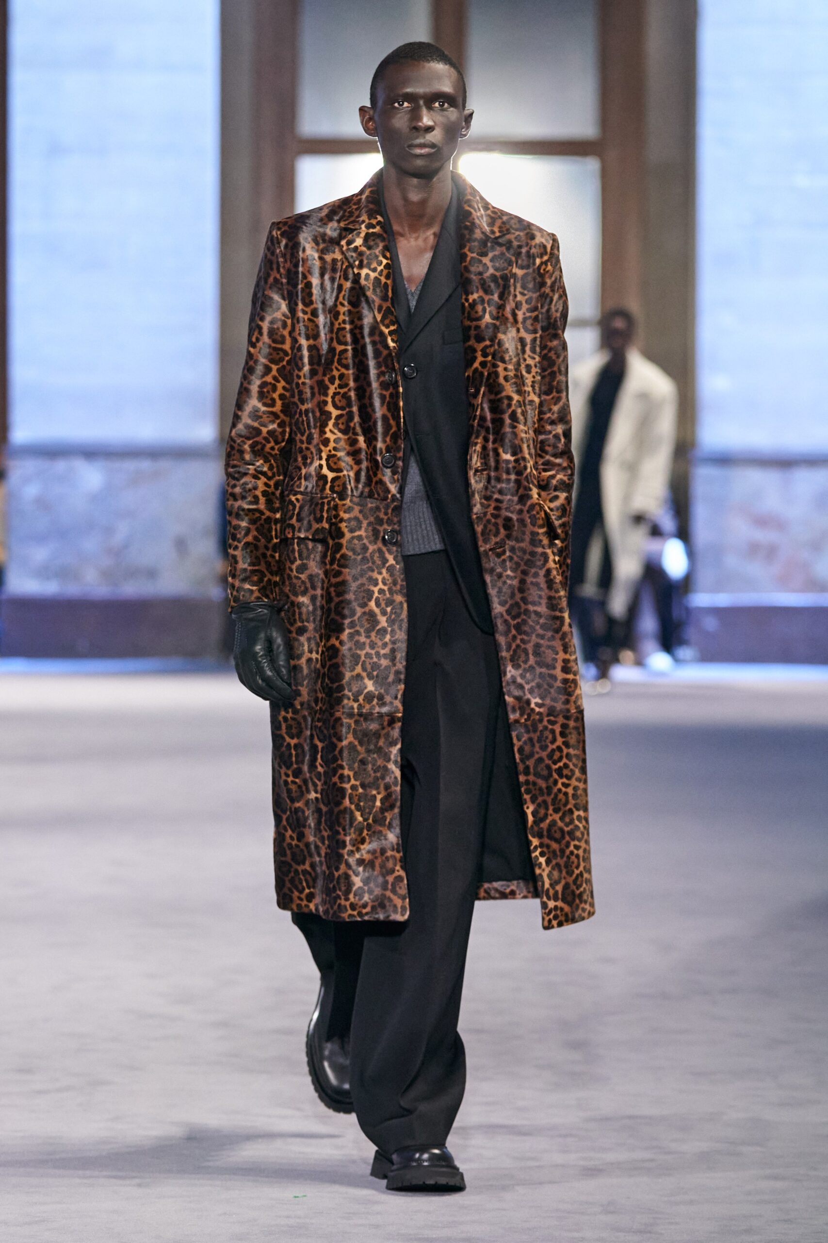 brown animal-print leather coat and black tailored pants