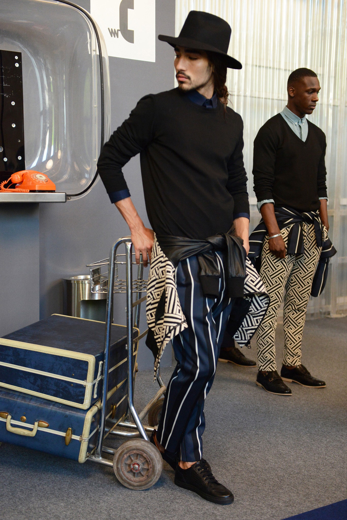 black sweater with striped pants