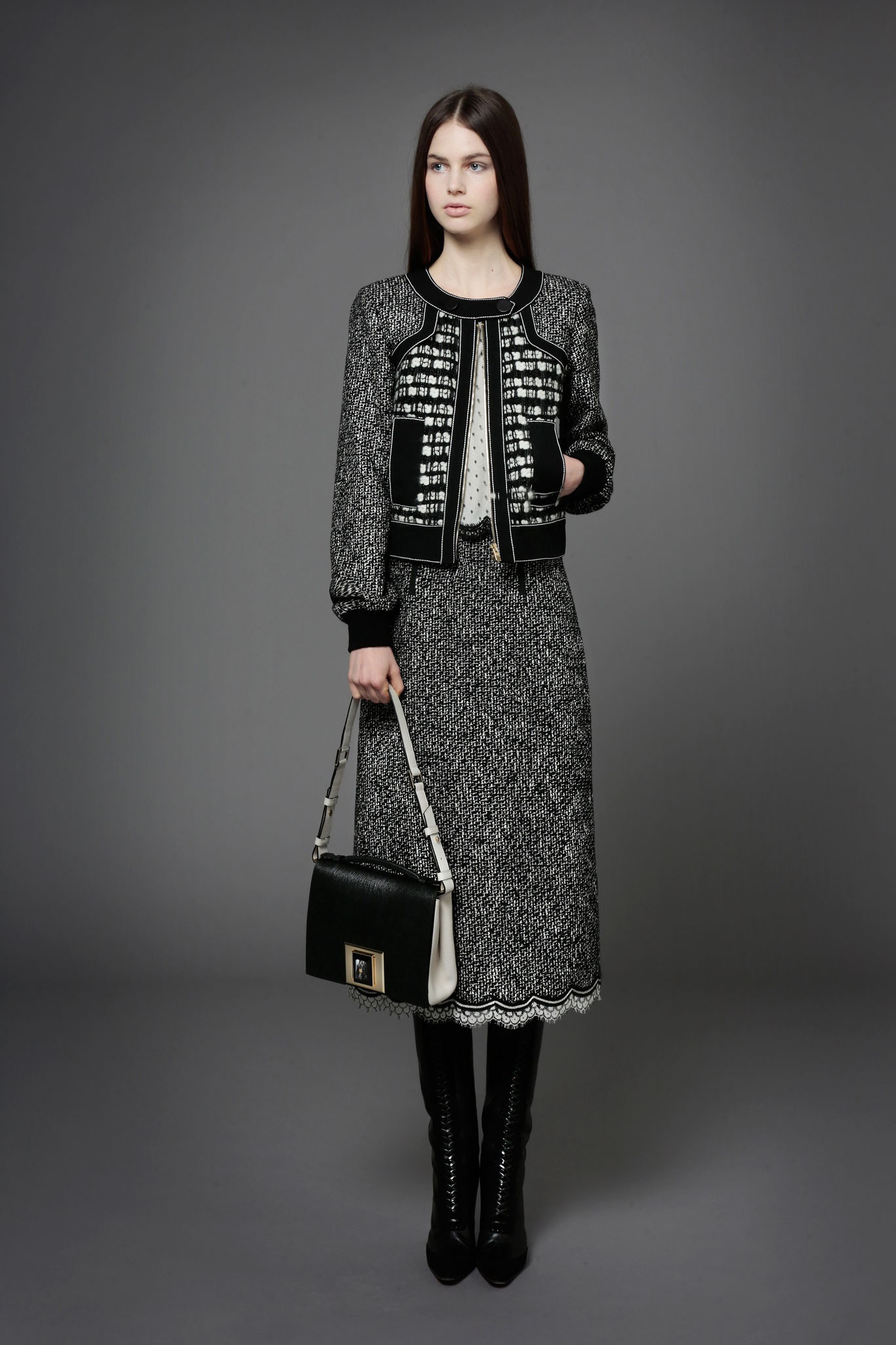 black and white fitted jacket and midi skirt
