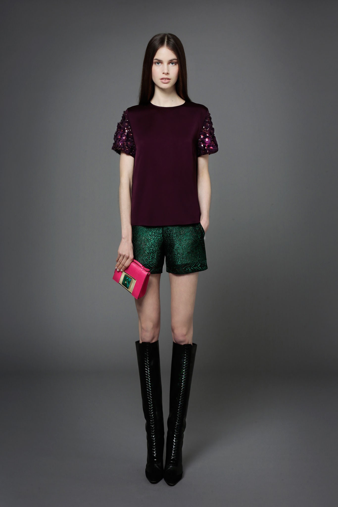 purple beaded top with green shorts