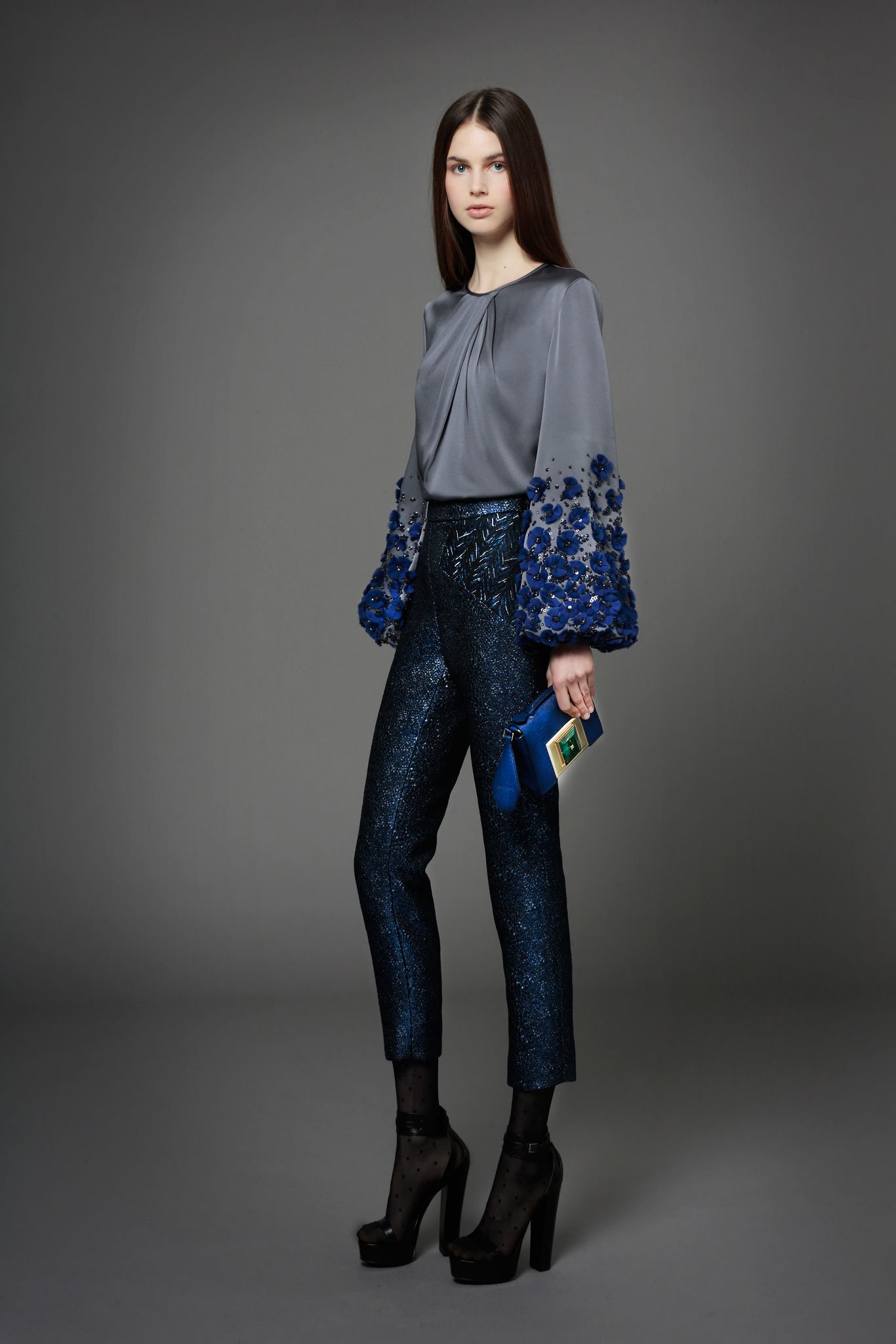 gray silk top with blue pants