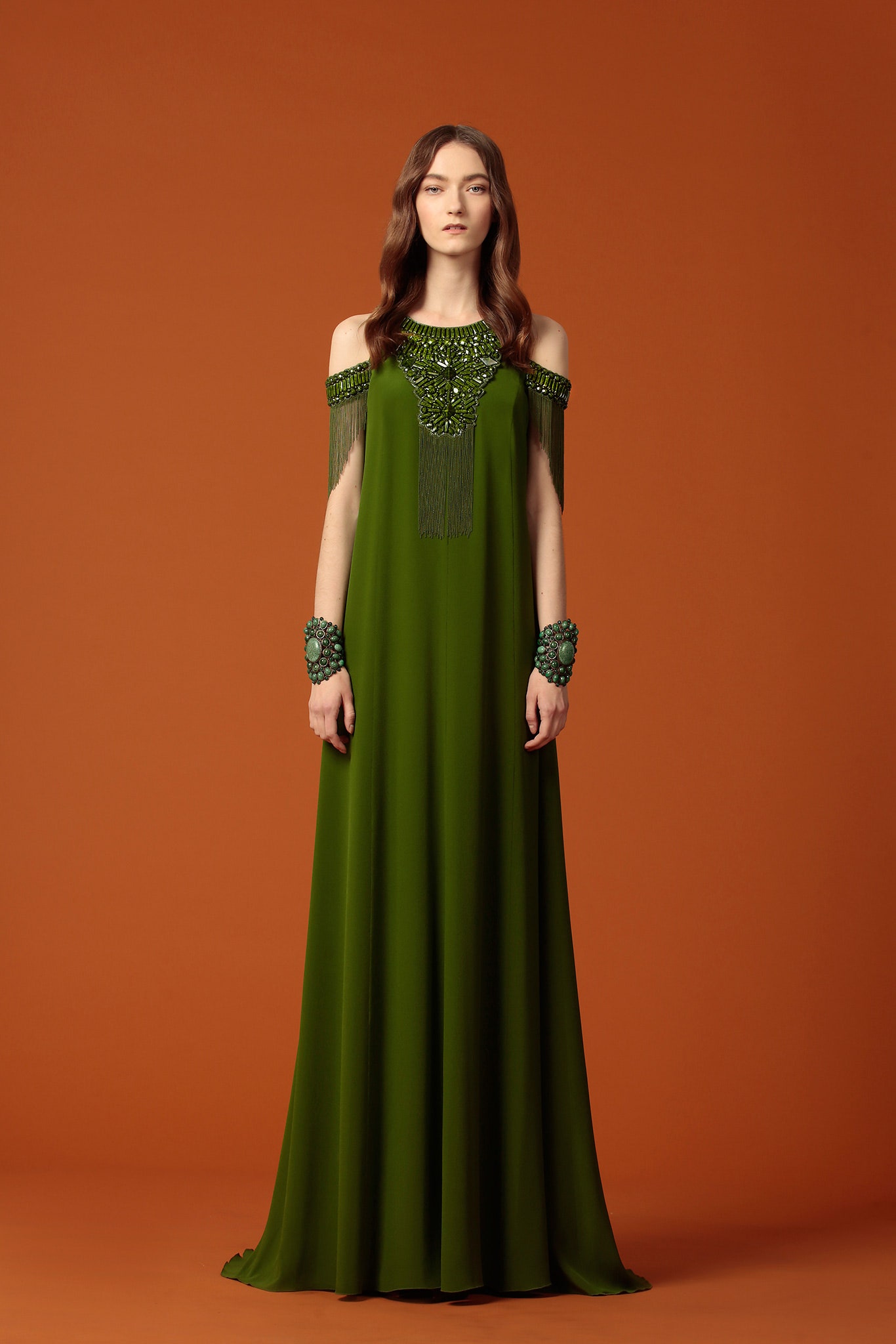 green off-shoulder gown with embellishments