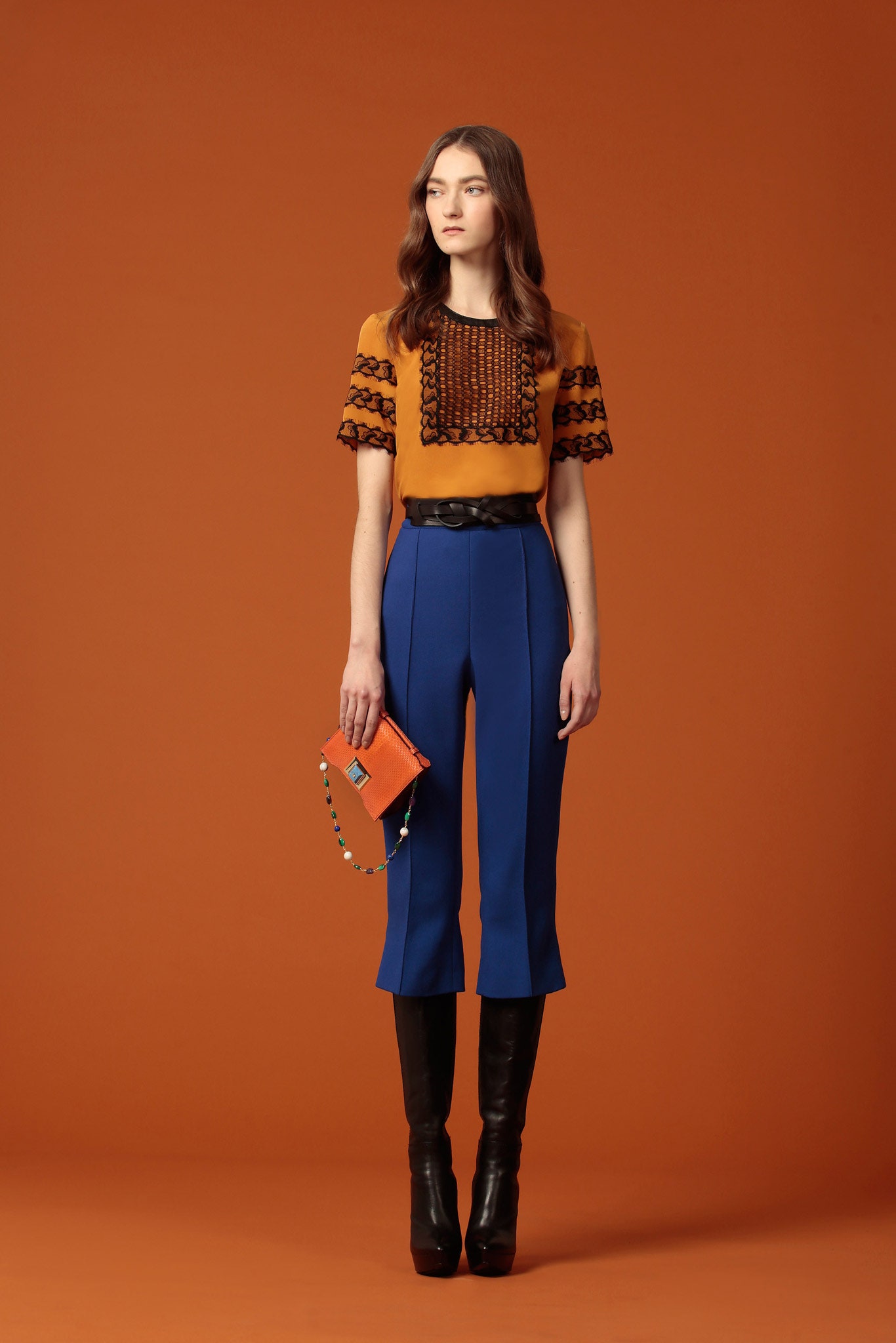 orange embroidered top with blue pants
