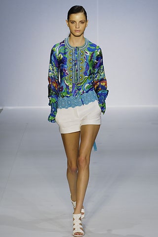 embroidered blue silk blouse with white shorts