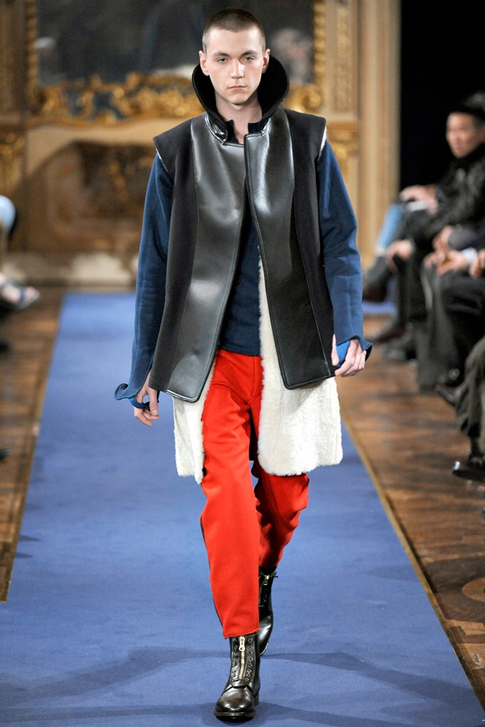 black leather coat with red pants