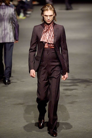 black tailored suit with red shirt