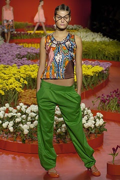 multi-colored sleeveless top and green pants
