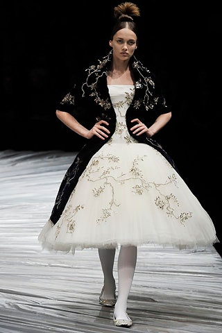 white embroidered midi dress with black coat