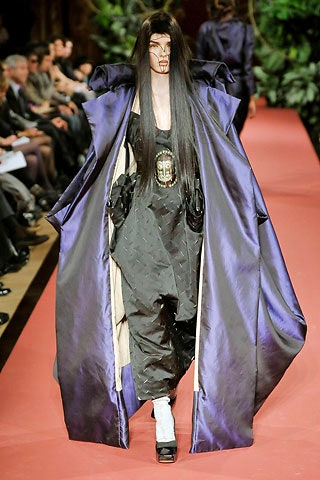 purple silk cape and black jumpsuit