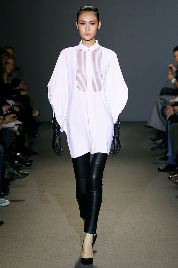 white relaxed blouse with black leather pants