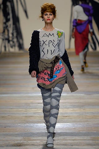 gray printed top with beige skirt