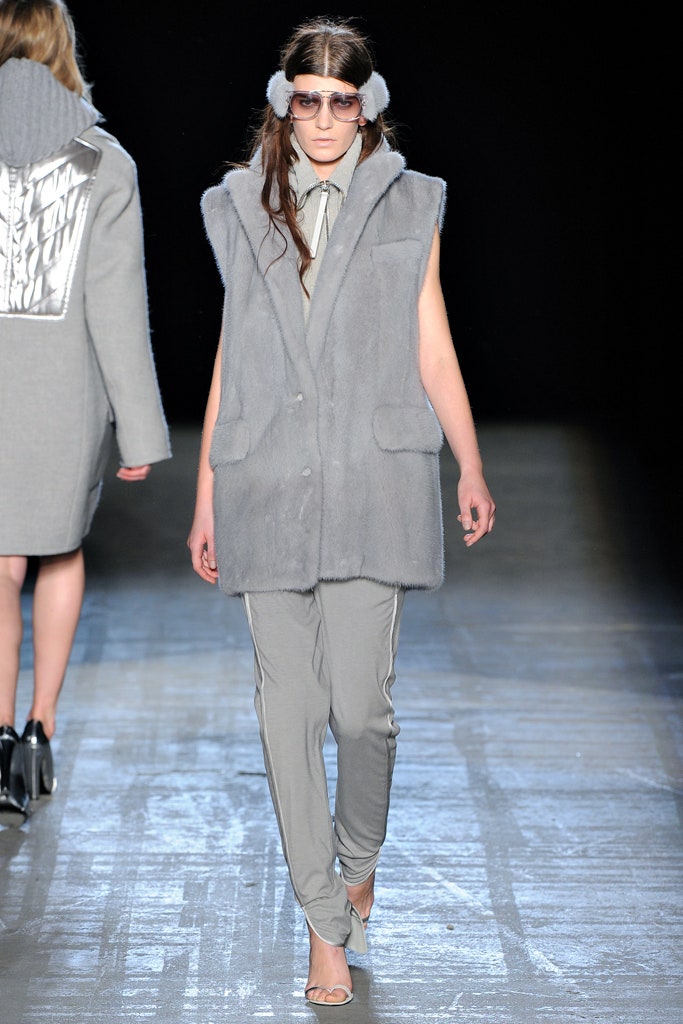 gray faux-fur vest with slim pants