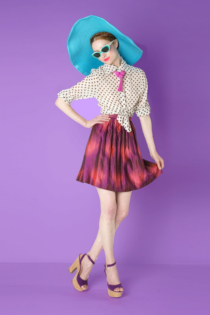 polka-dot blouse and pleated skirt