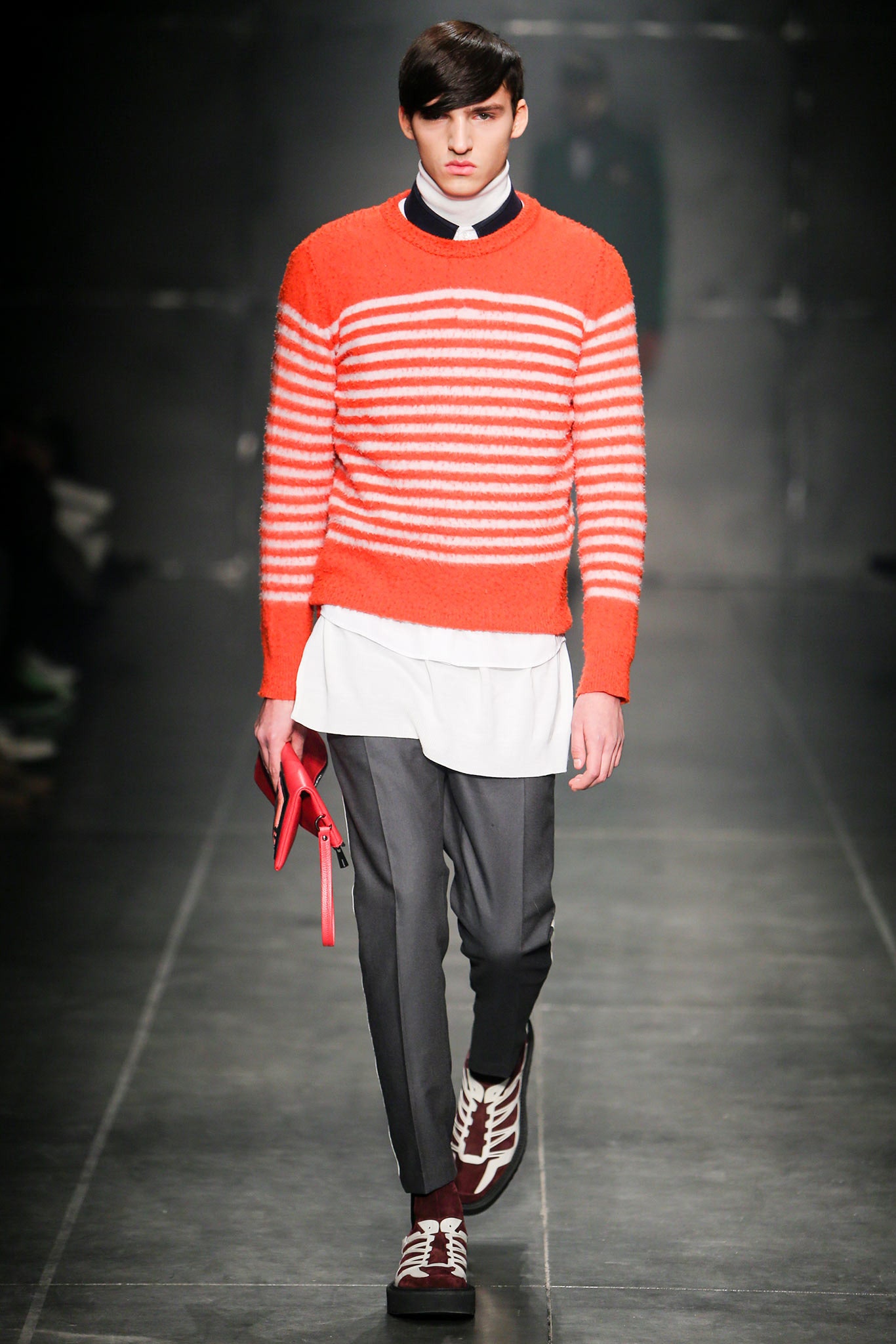 orange striped sweater with gray pants