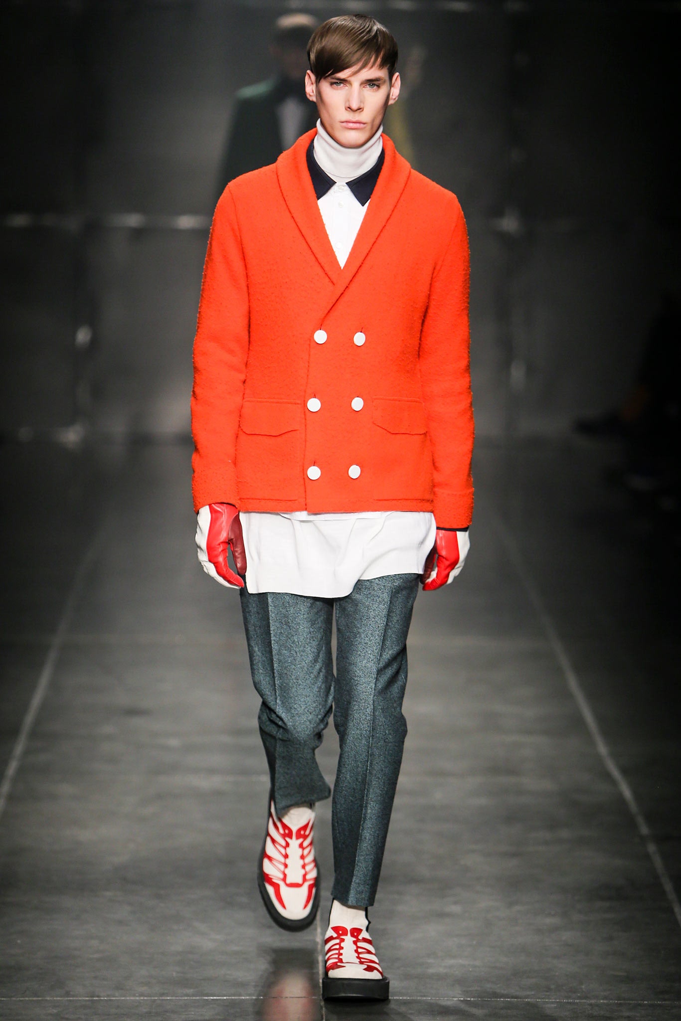 orange fitted jacket with gray pants