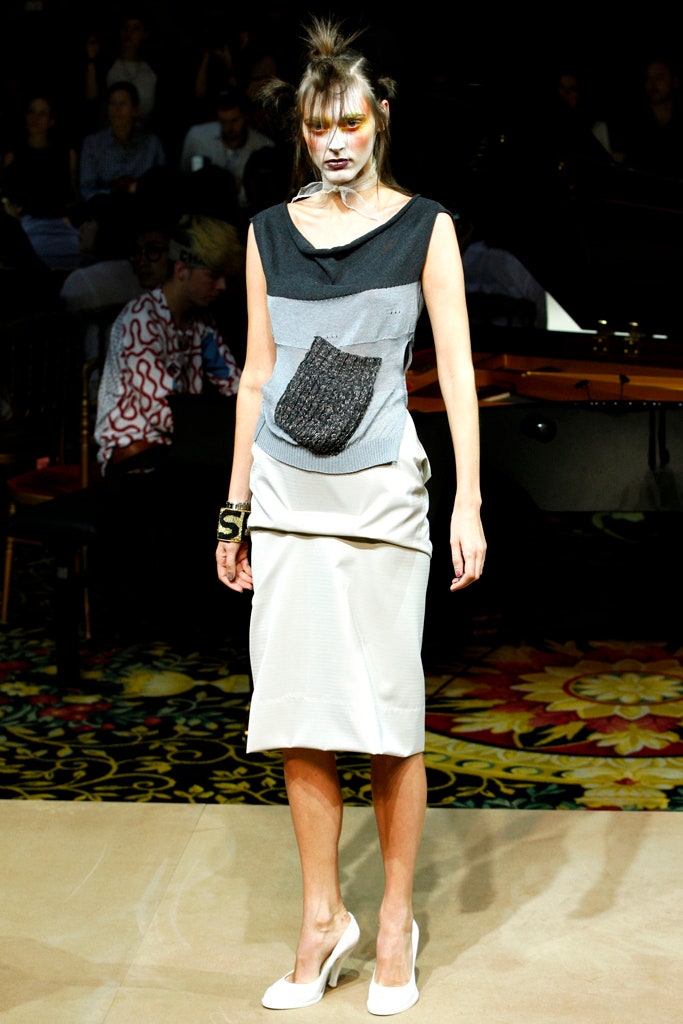 gray sleeveless top with beige pencil skirt