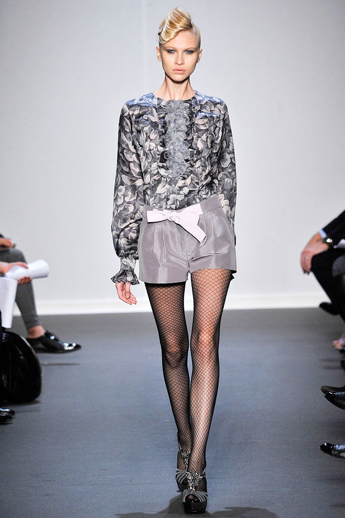 gray silk blouse with beige tailored shorts