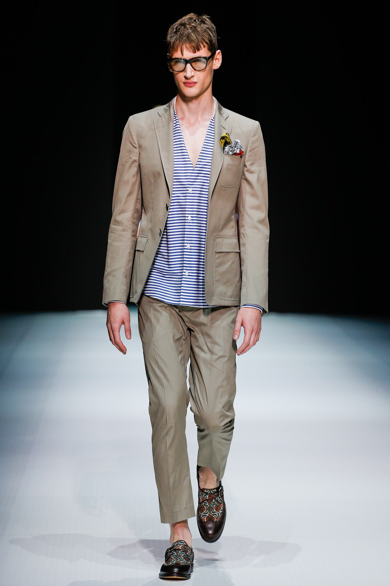 beige tailored suit with striped shirt