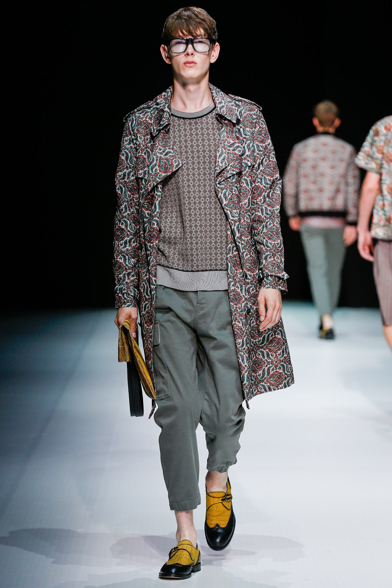 multi-patterned trench coat with gray sweater