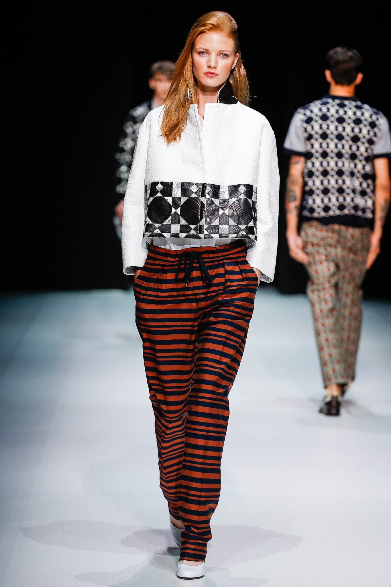 white and black color-blocked jacket with striped pants