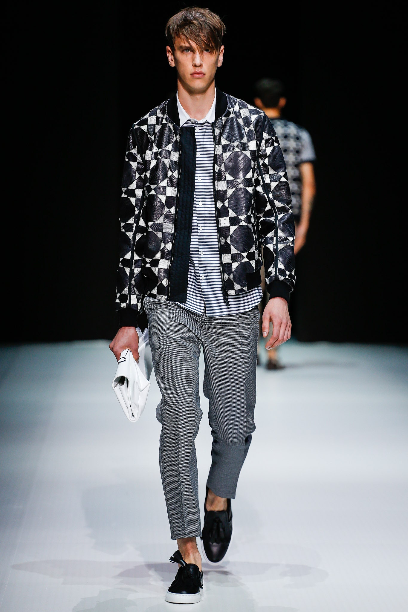 black and white printed jacket with gray pants