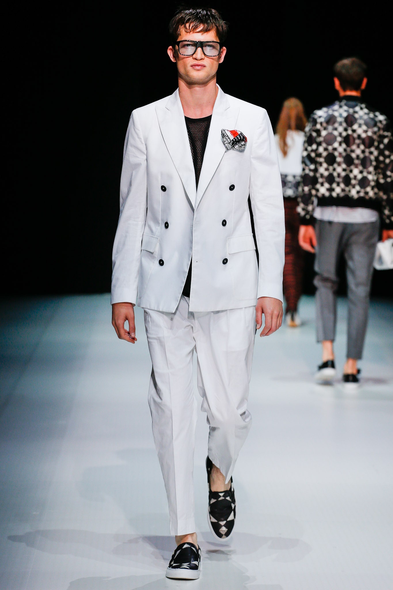 white tailored suit with black shoes