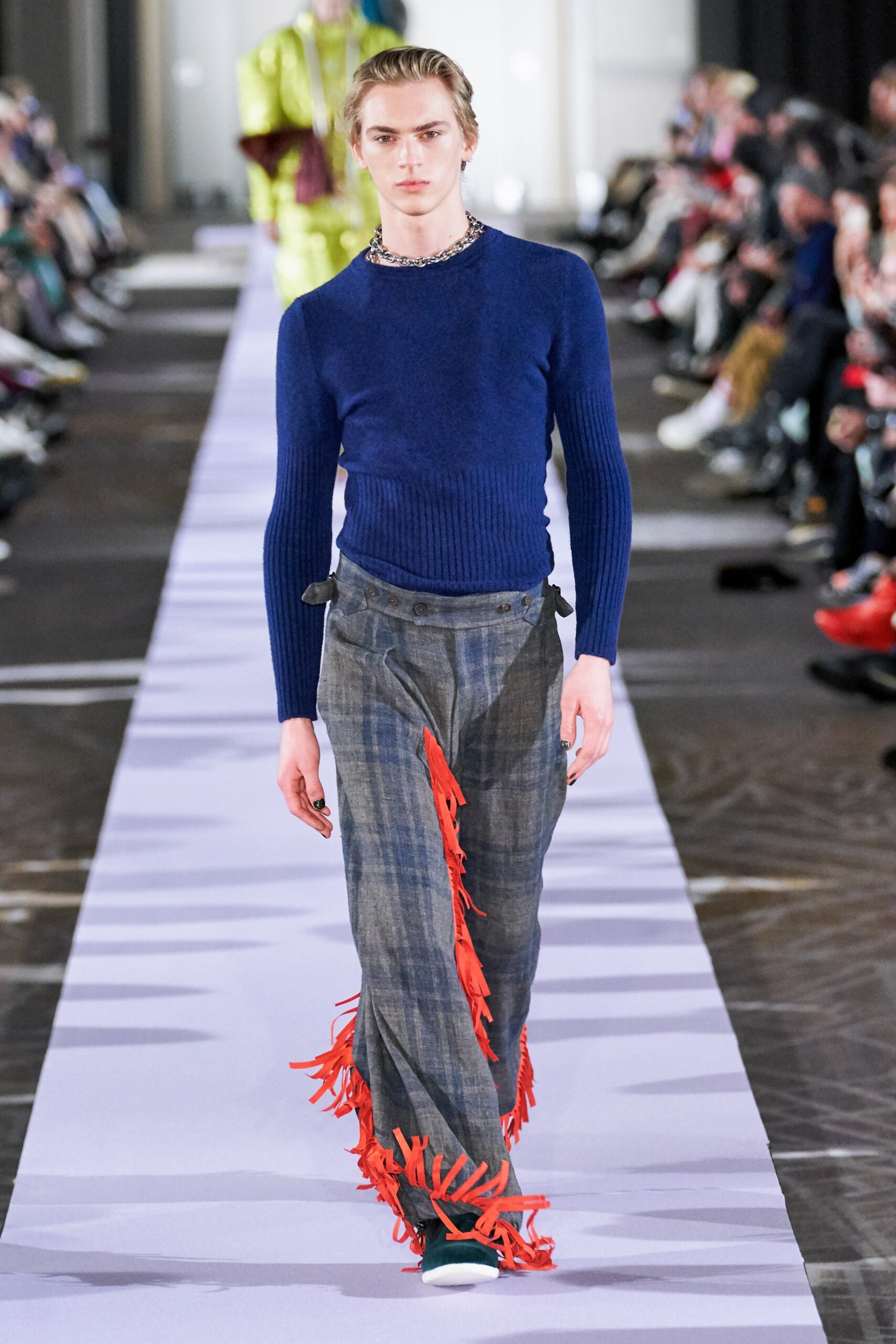 blue fitted sweater and gray pants