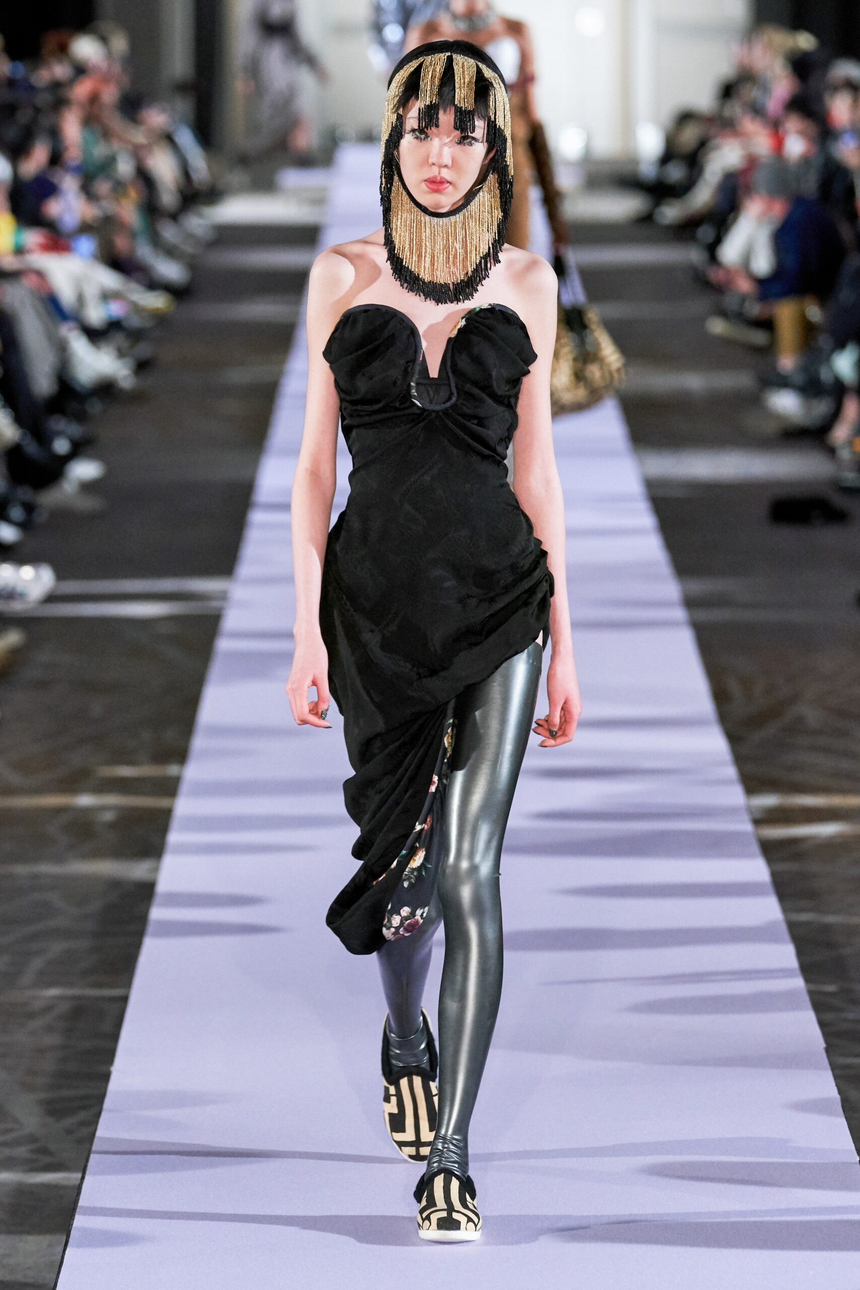 black fitted midi dress with vinyl pants