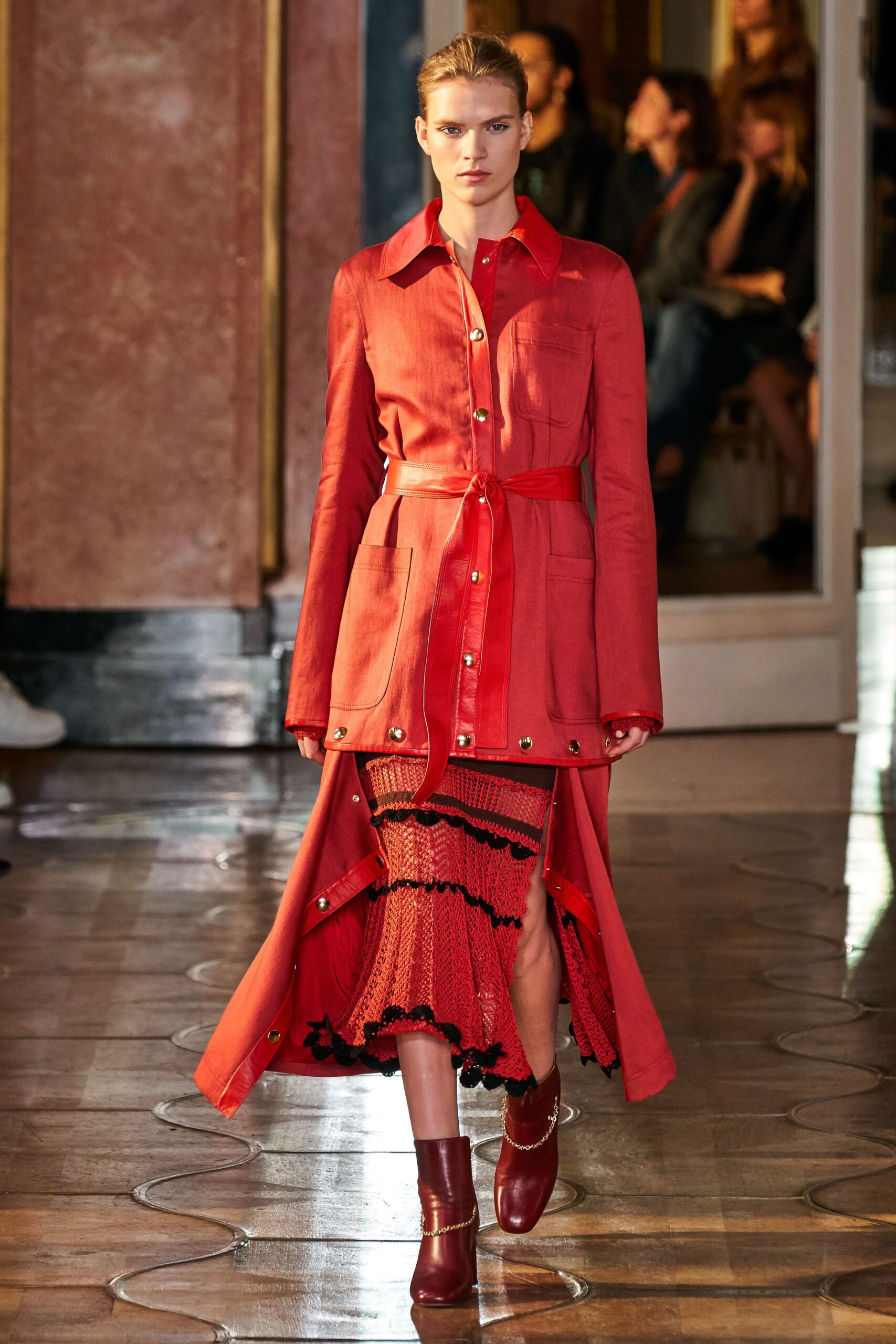red fitted coat with black skirt