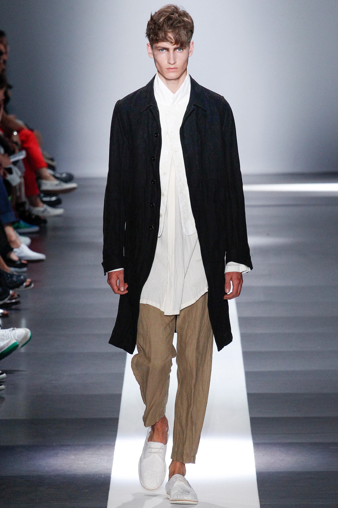 black coat white shirt beige pants