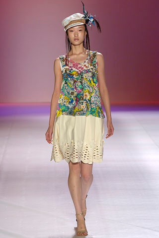 multi-colored floral top with beige skirt