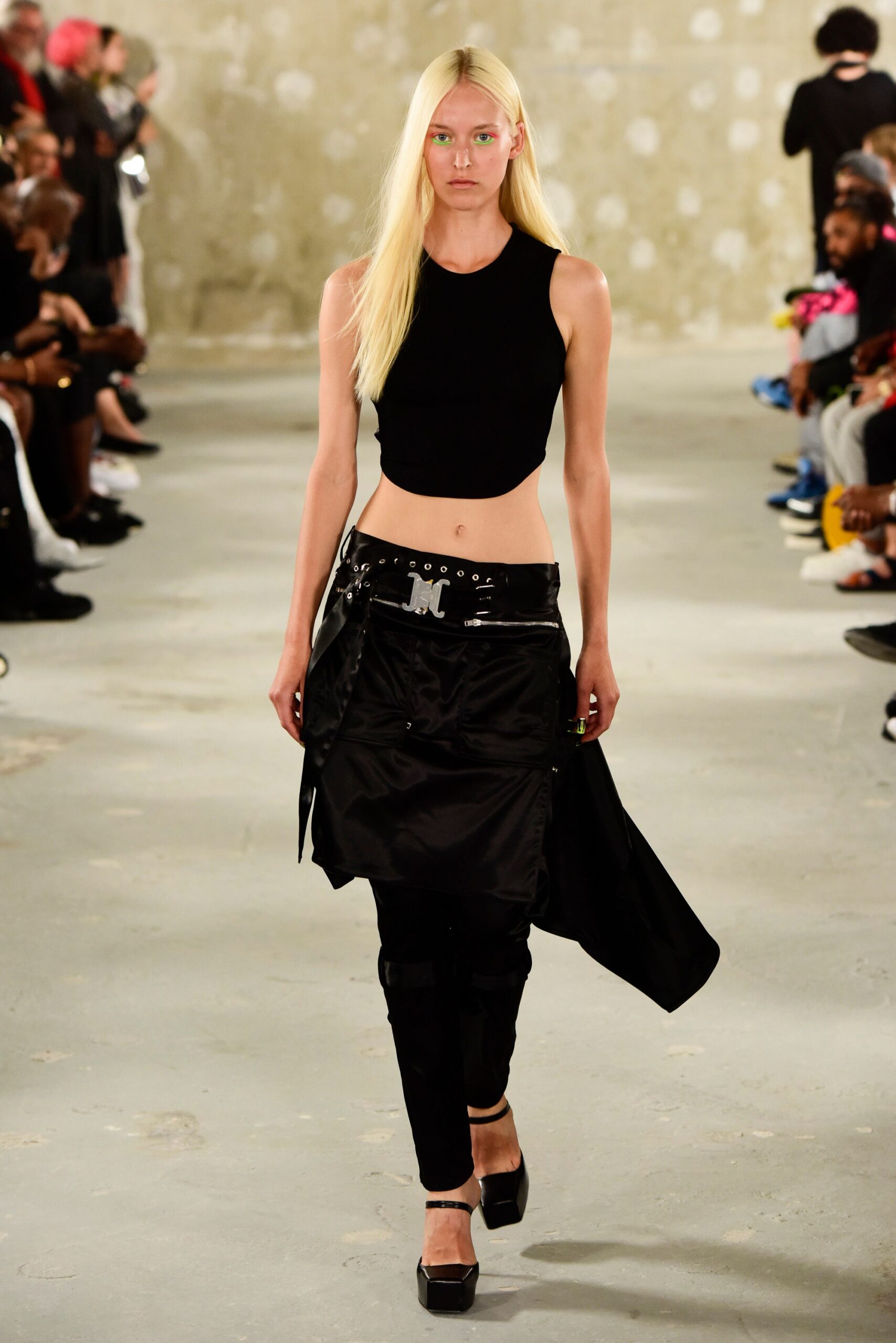 black sleeveless high-neck fitted top