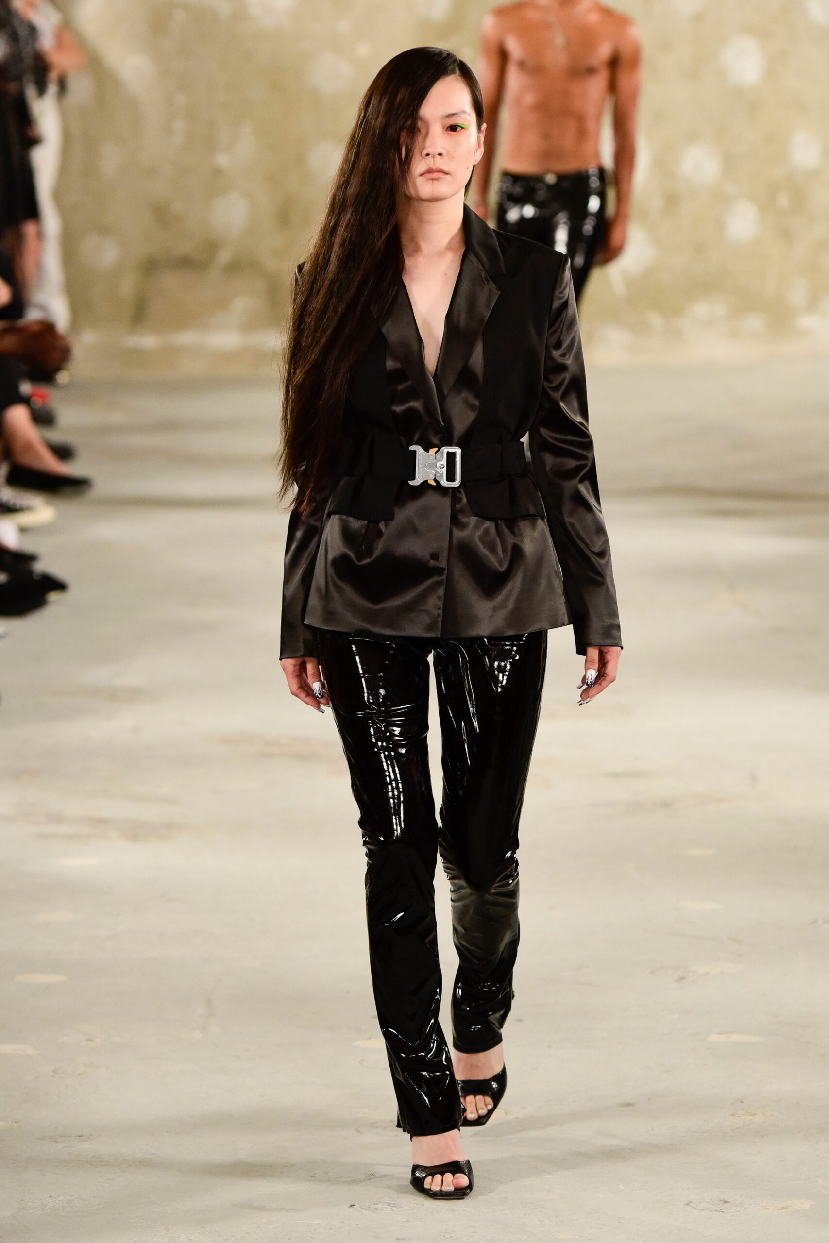 black satin tailored blazer and vinyl pants