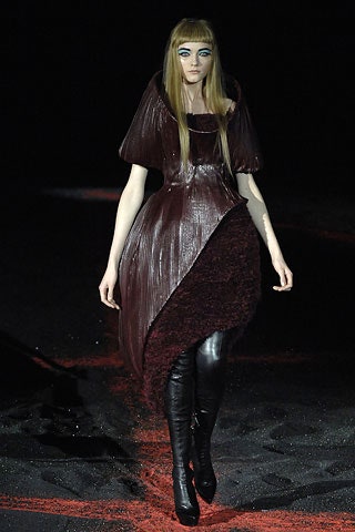 maroon asymmetric pleated dress with black boots