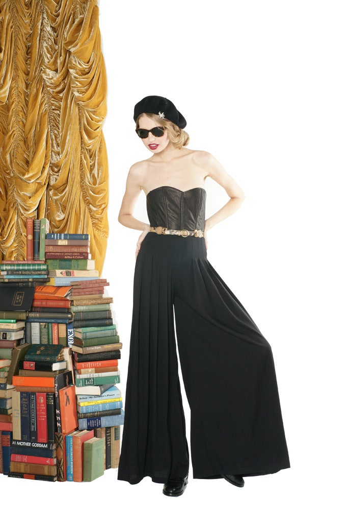 black leather bustier and wide-leg pants