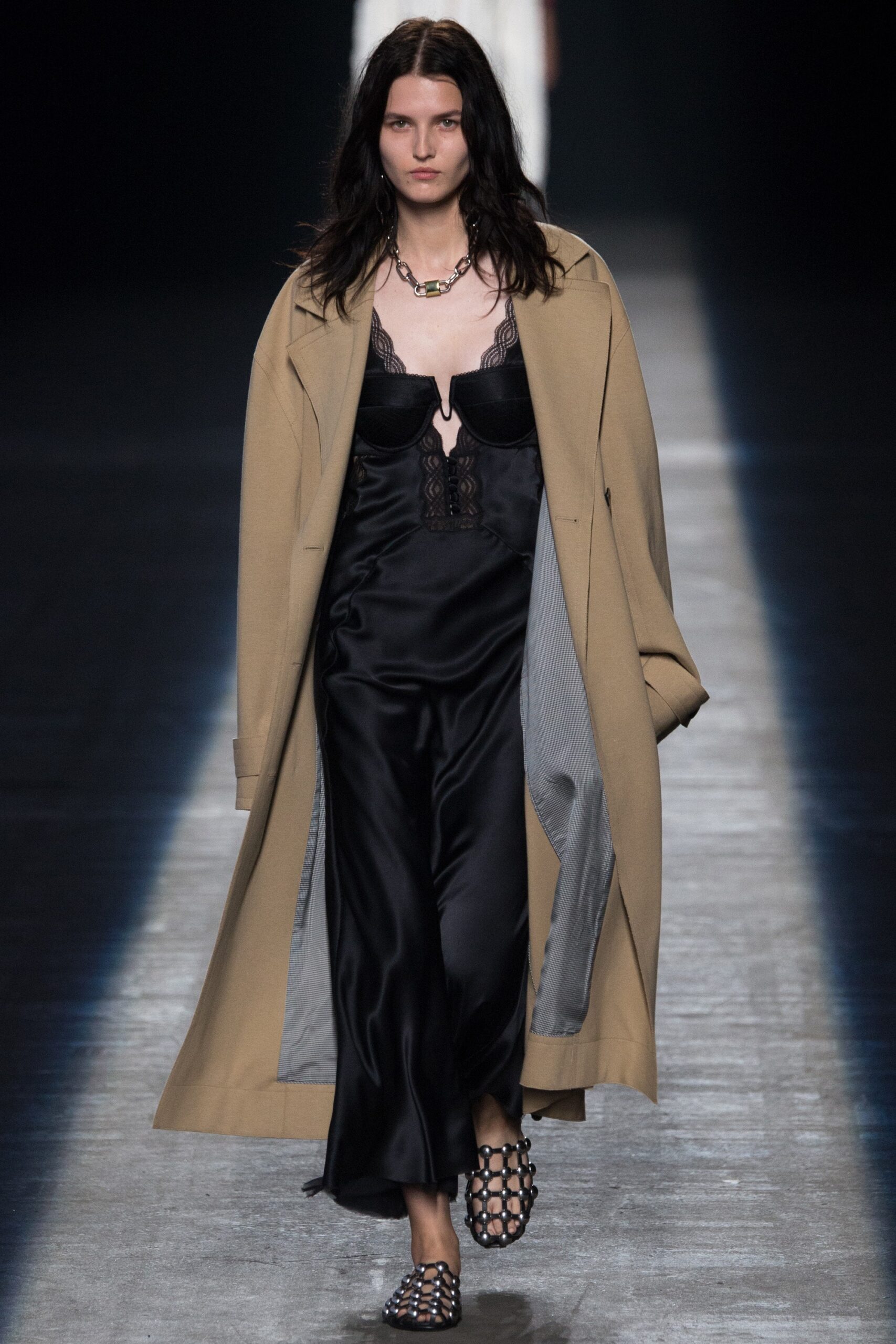 beige oversized coat and black silk dress