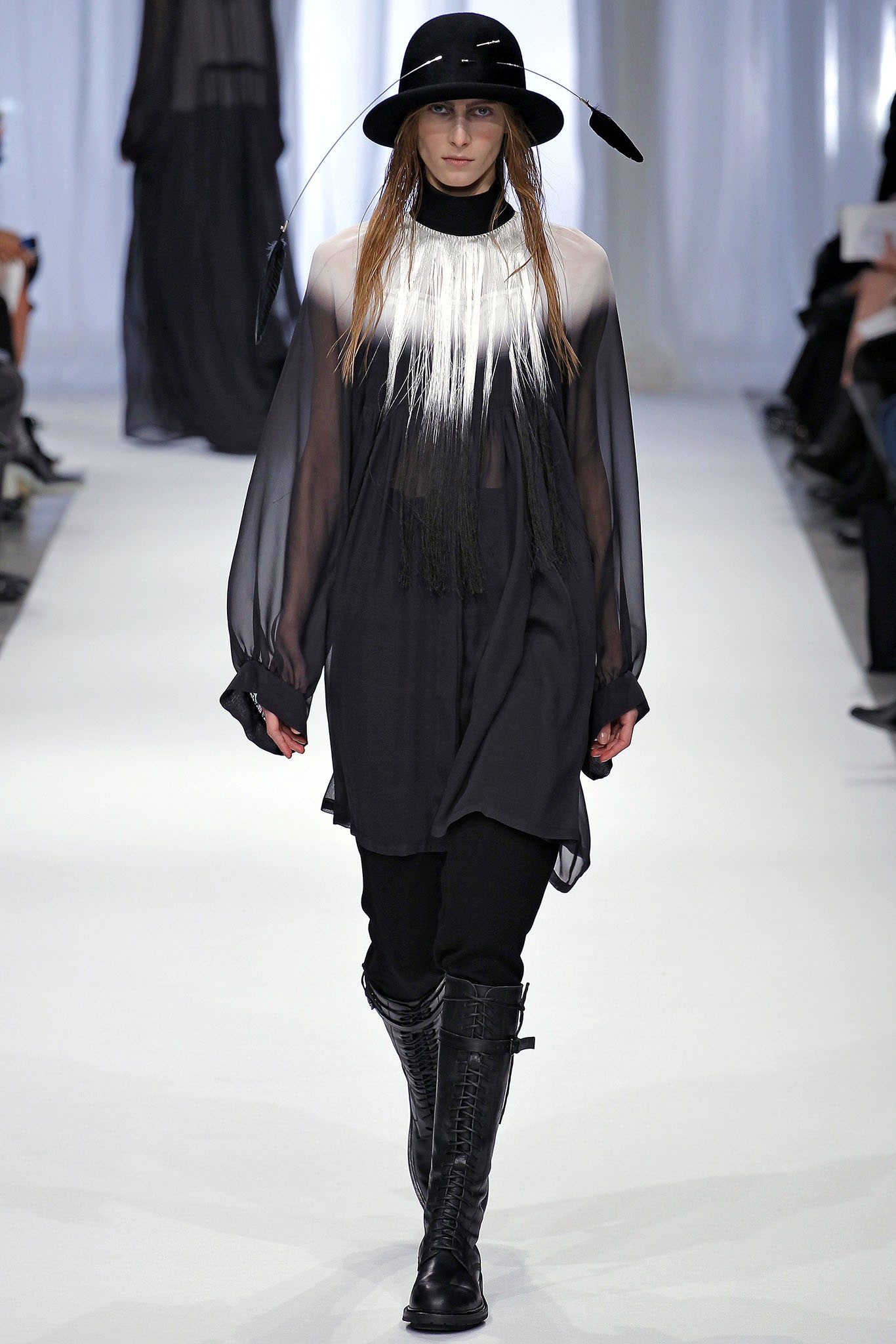 sheer black top with relaxed pants