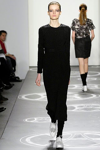black fitted midi dress with white shoes