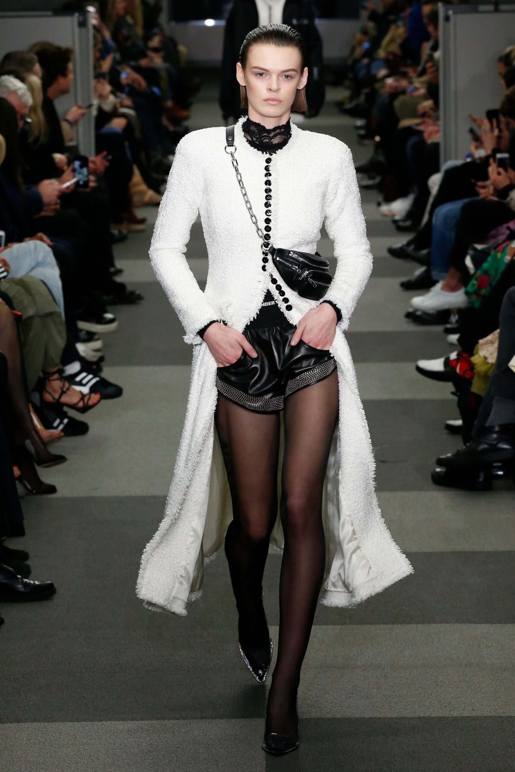 white fitted coat with black shorts