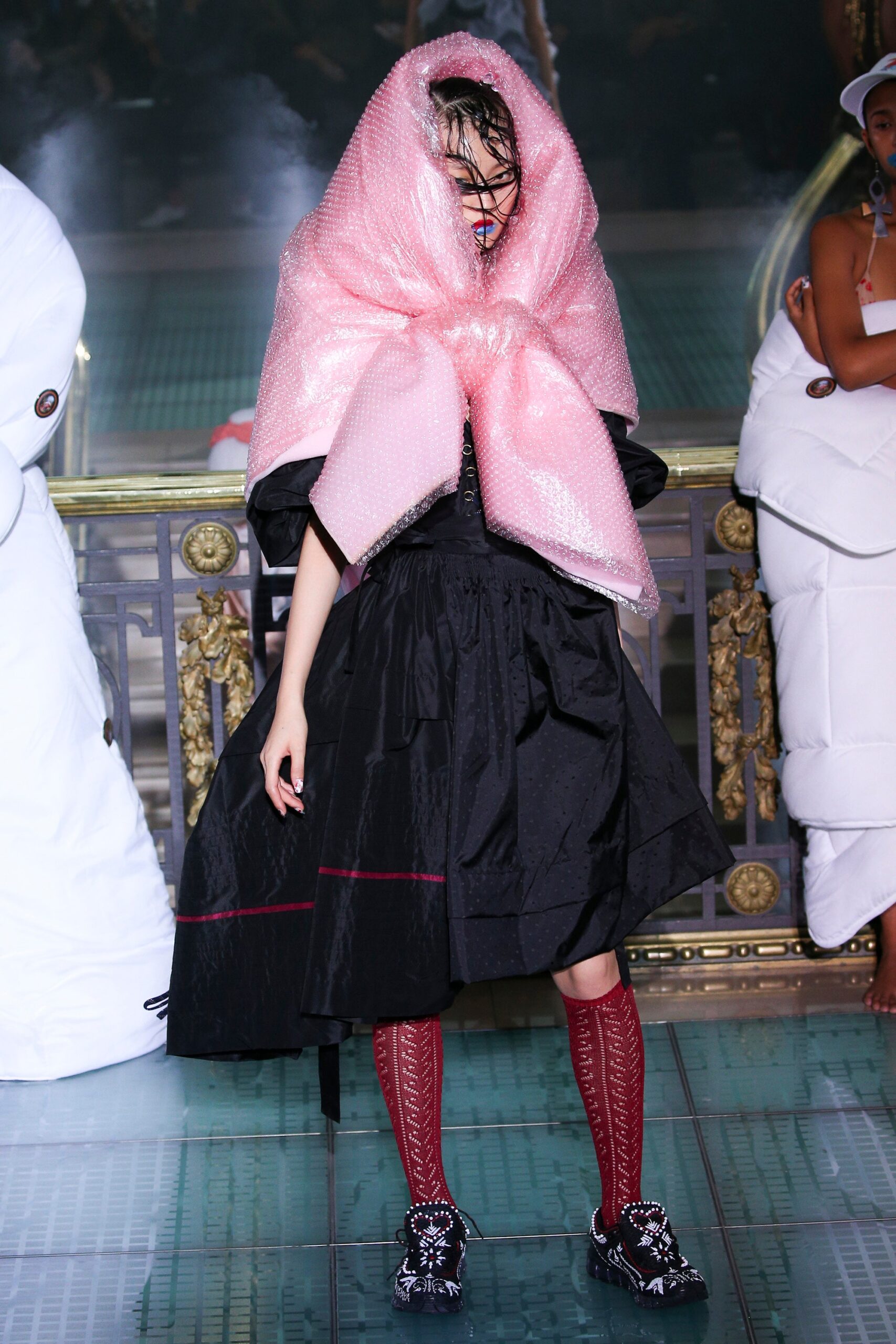 black fitted dress with pink cape