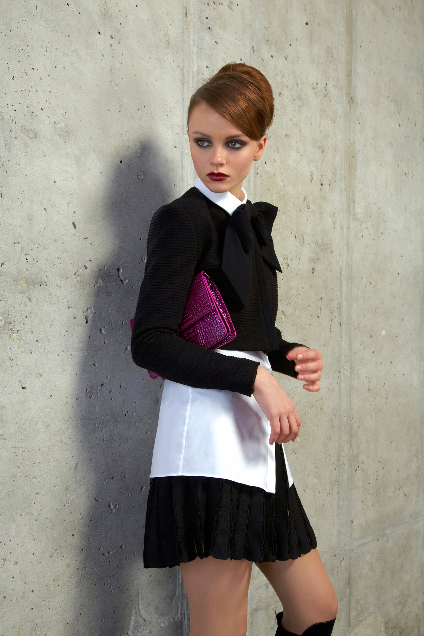 black fitted blouse and mini skirt