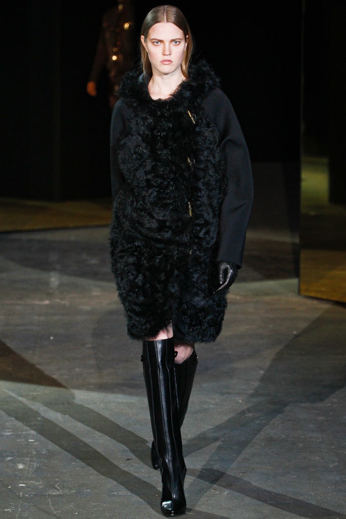 black faux-fur coat with leather boots