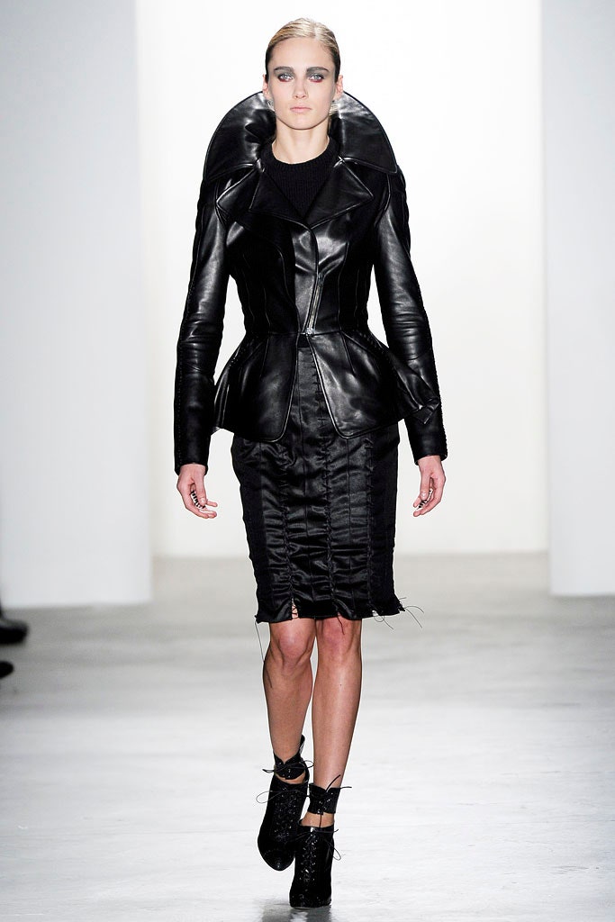 black leather coat and fitted dress