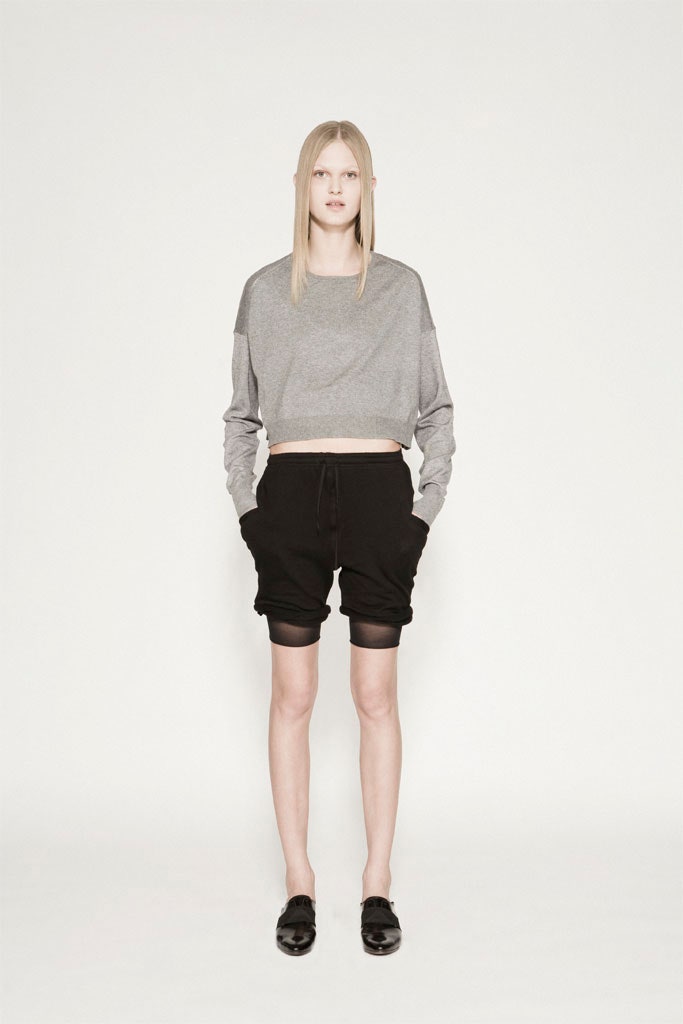 gray cropped top and black shorts