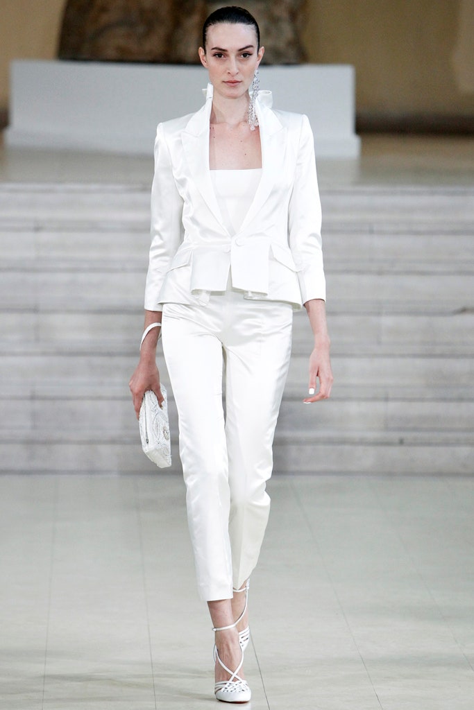 white tailored suit with clutch