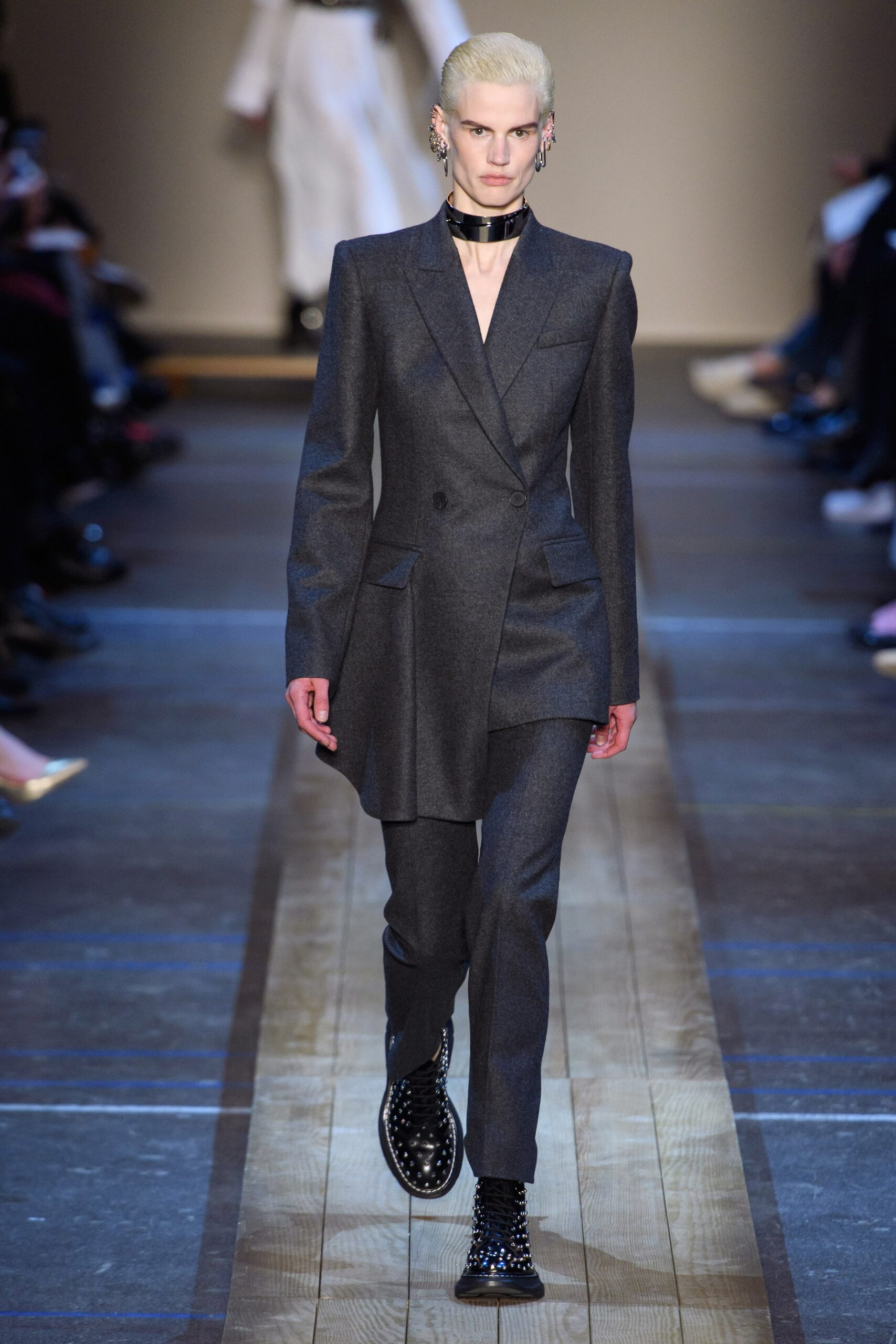 gray tailored suit with black boots