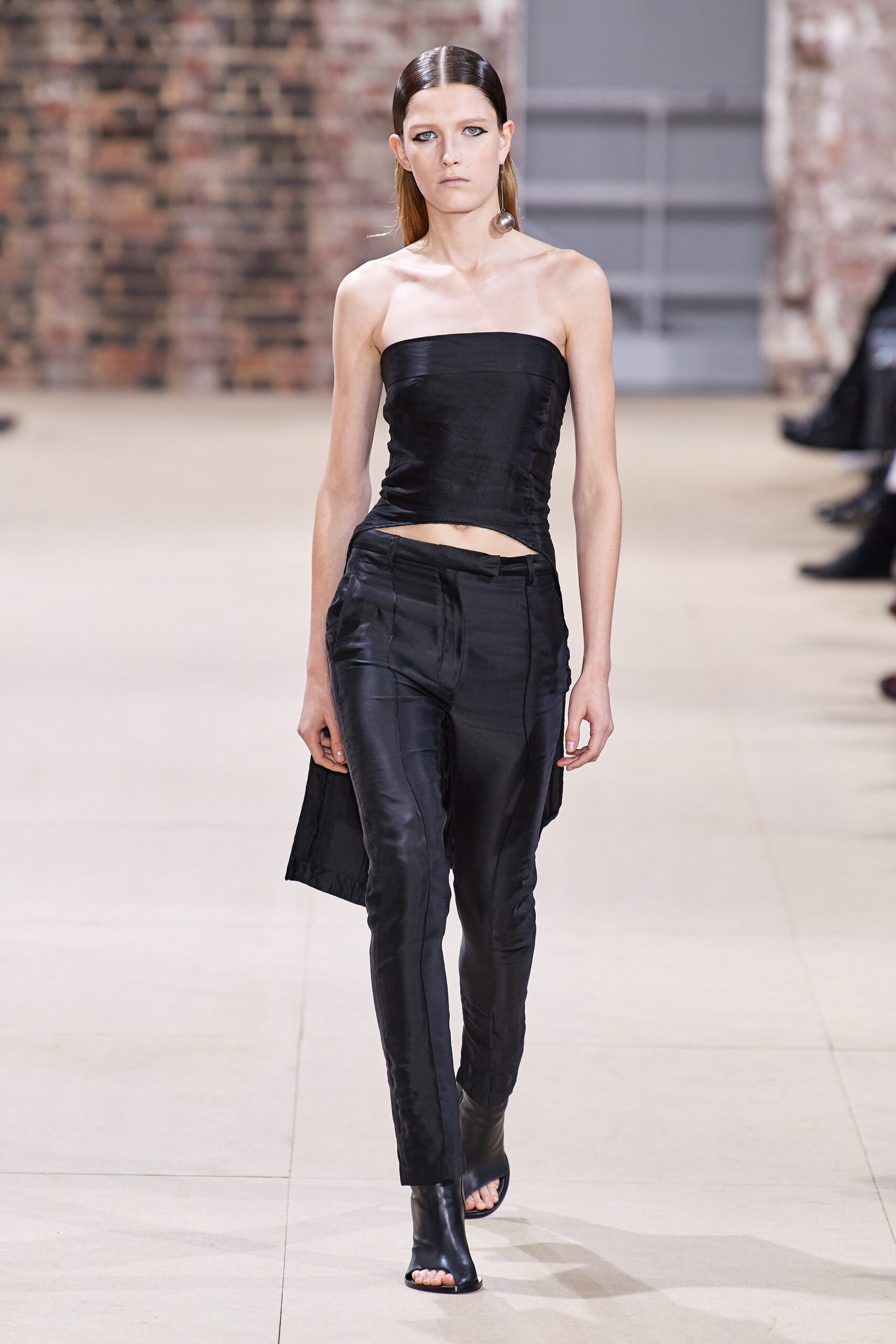 black silk cropped top and fitted pants